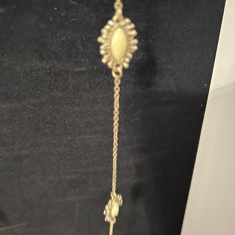 Strand of beads, off-white, or ivory in color